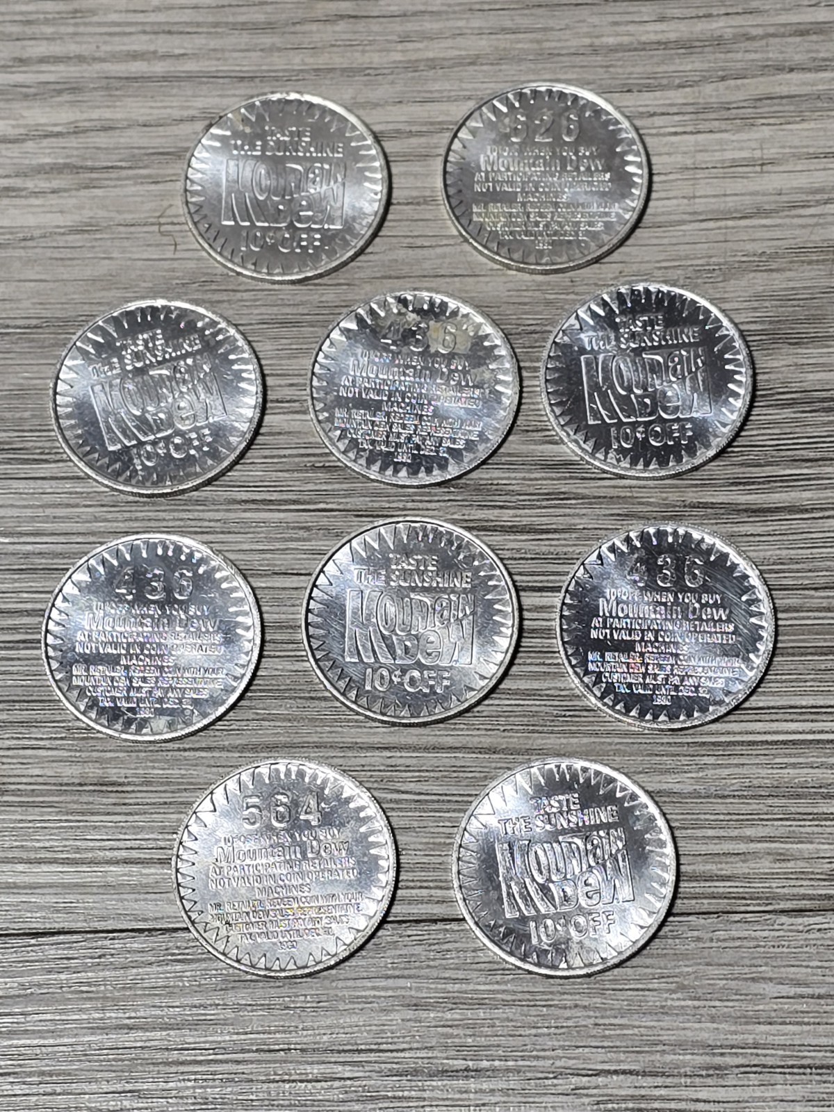 1980 Lot of 10 Mountain Dew Soda Taste The Sunshine 10 Cent Token Aluminum Coin