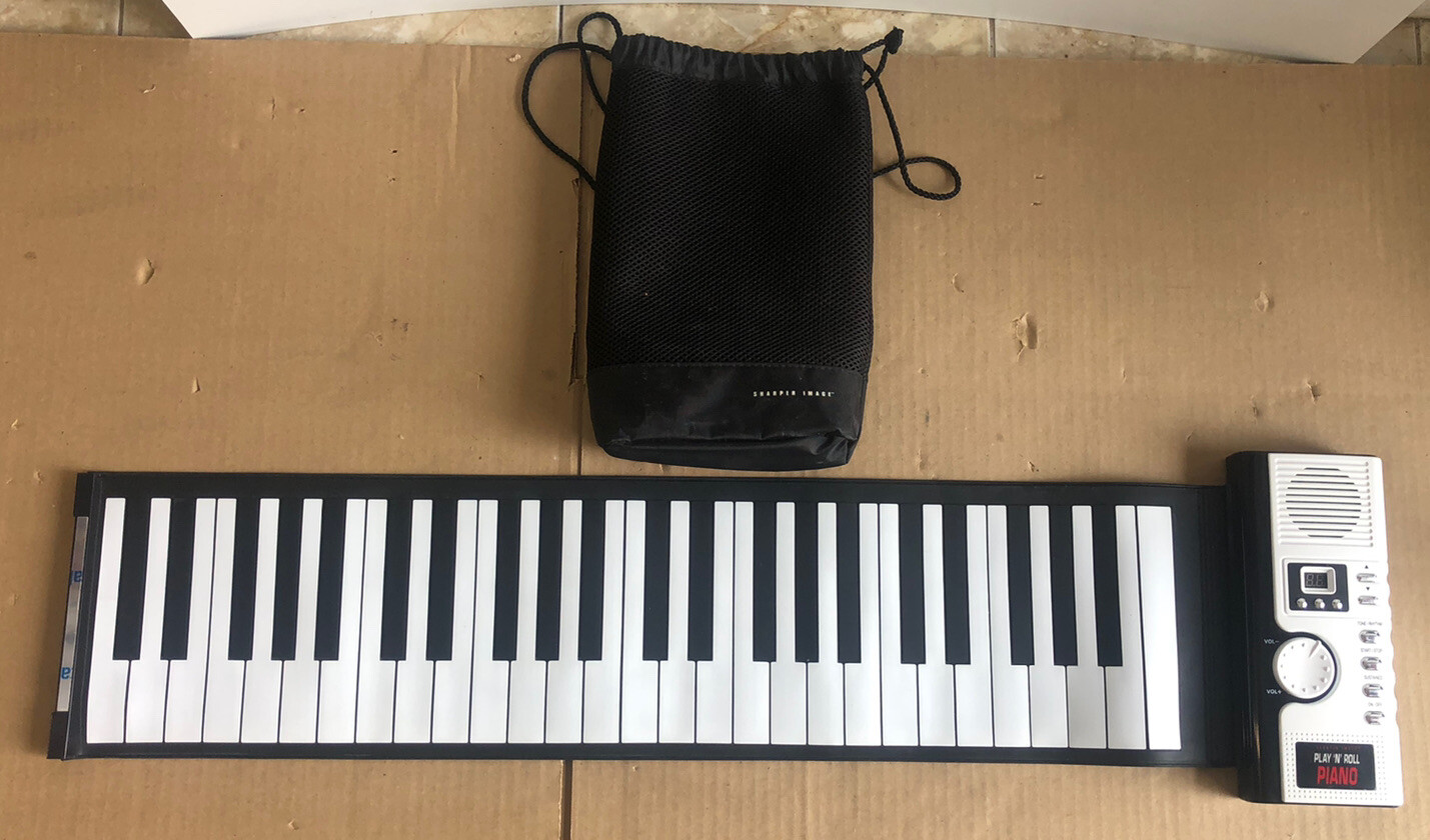 GREAT SHAPE The Sharper Image Play 'N' Roll Digital Piano With Storage Case