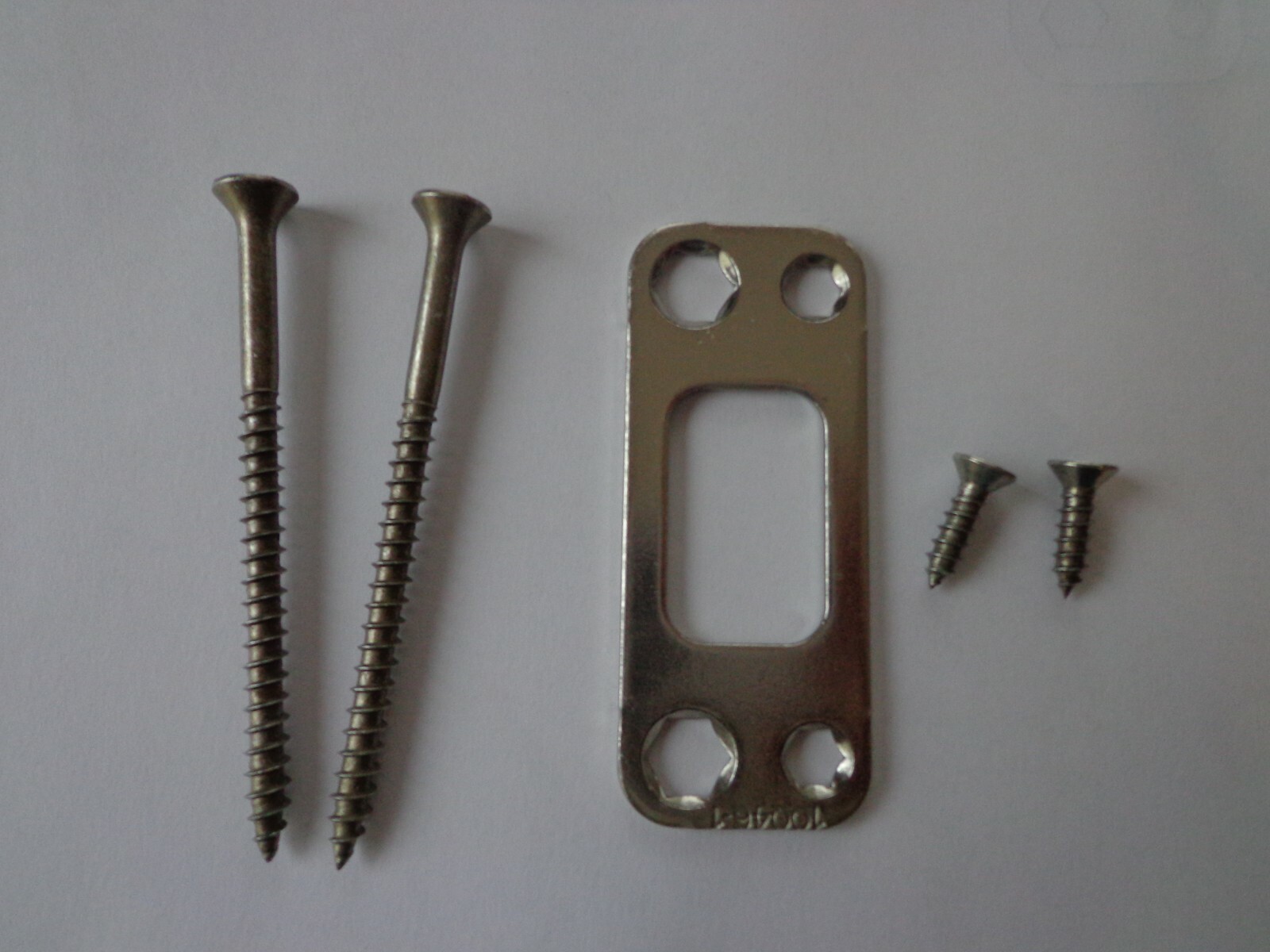 KWIKSET DEADBOLT STRIKE "REINFORCER" (3" SCREWS) NICKEL PLATE 1-1/8" X 2-3/4"