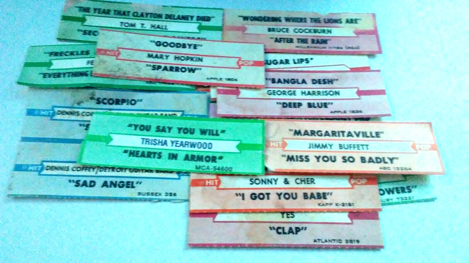 JUKEBOX STRIP IMPERFECT LOT OF 12+ BUFFETT-SONY + CHER-MORE 45-L@@K!