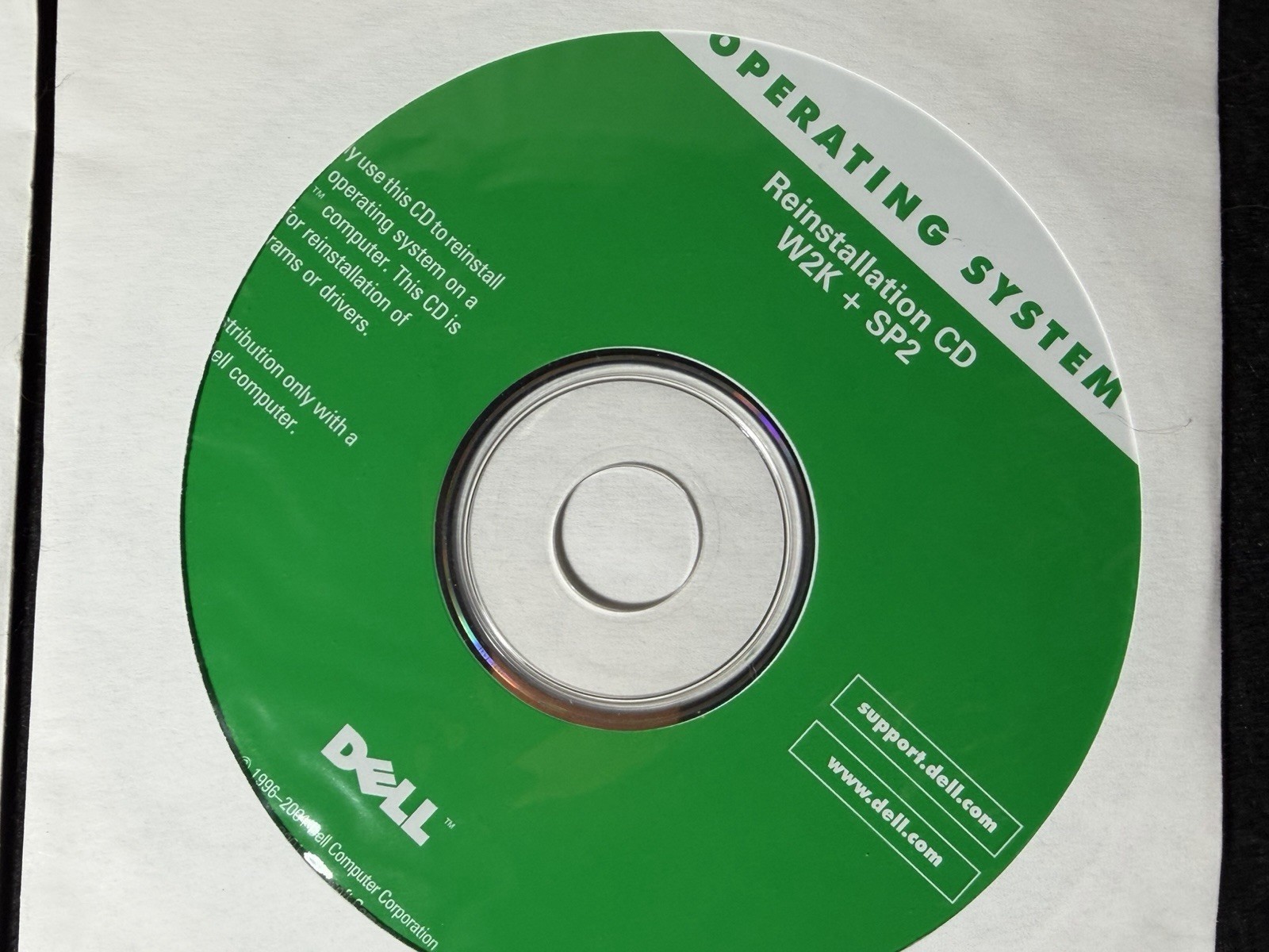 three vintage Dell reinstall CDs