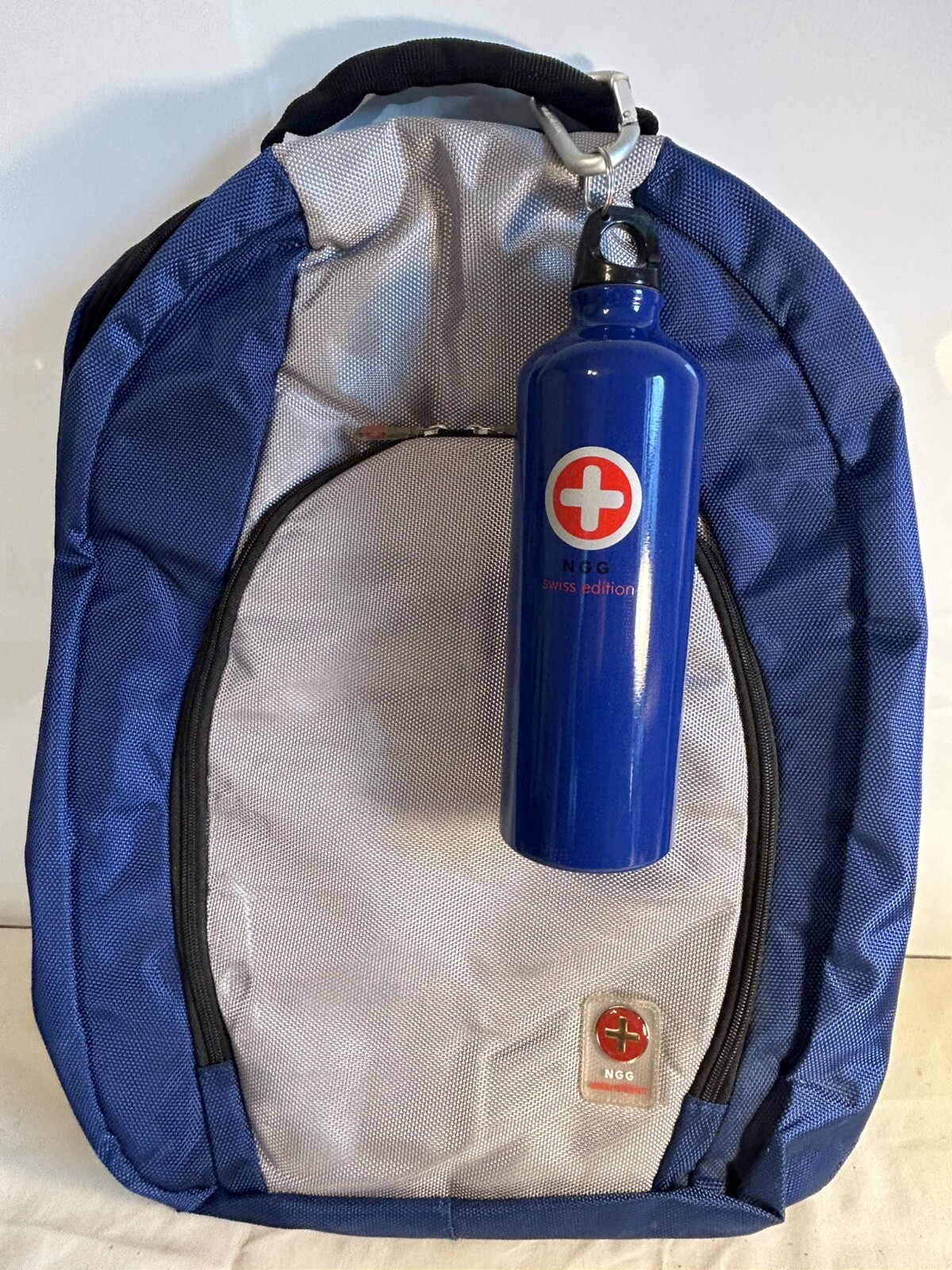 Blue/Grey NGG Swiss Edition Backpack with blue water bottle computer school