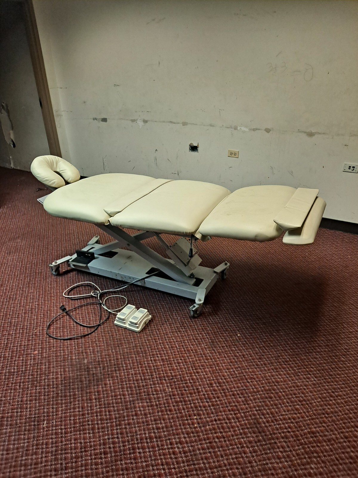 Professional grade powered massage table with vertical and tilt adjustment