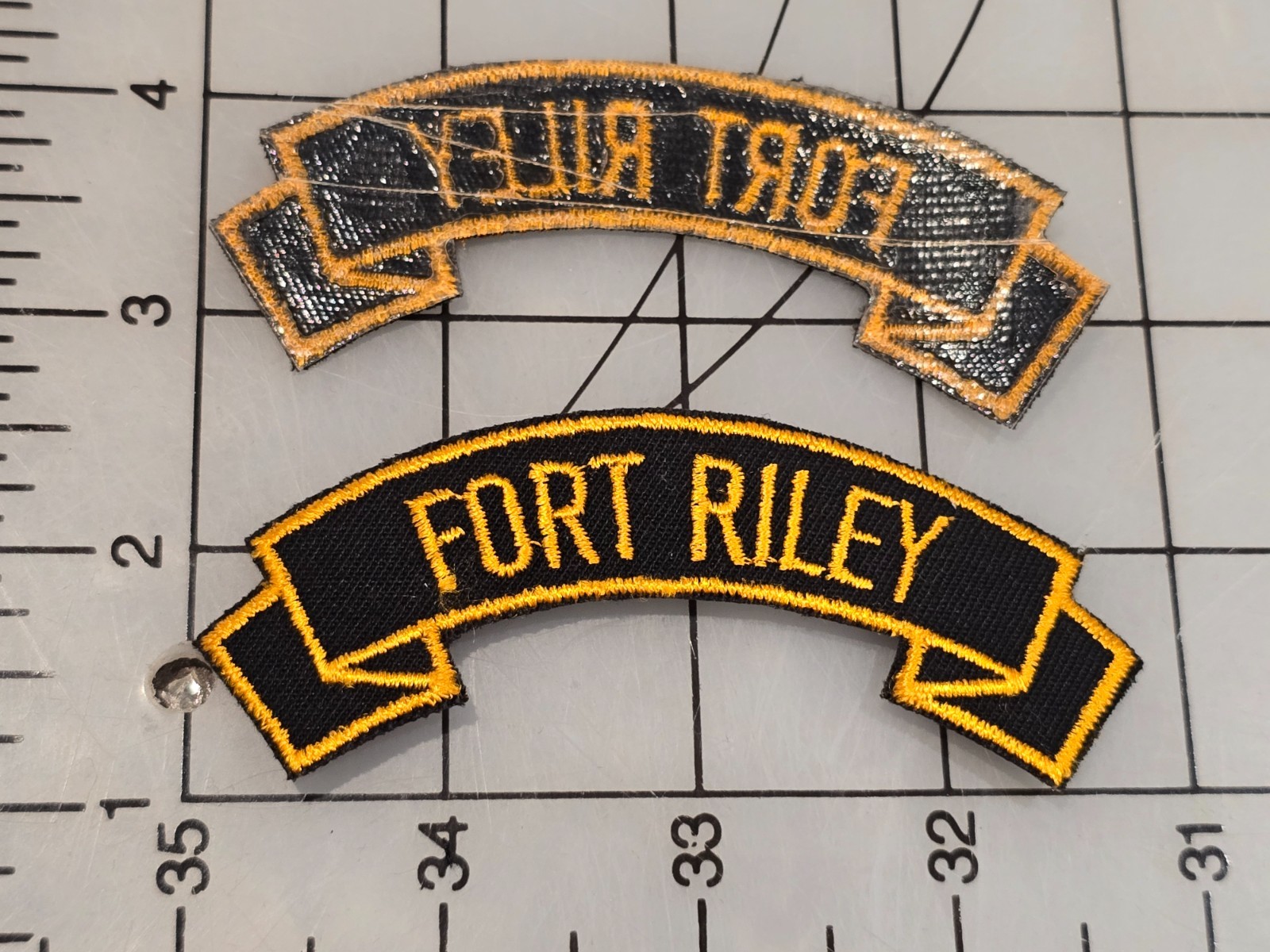 Surplus US Military Tab Fort Riley Glue Back Cut Edge 4526