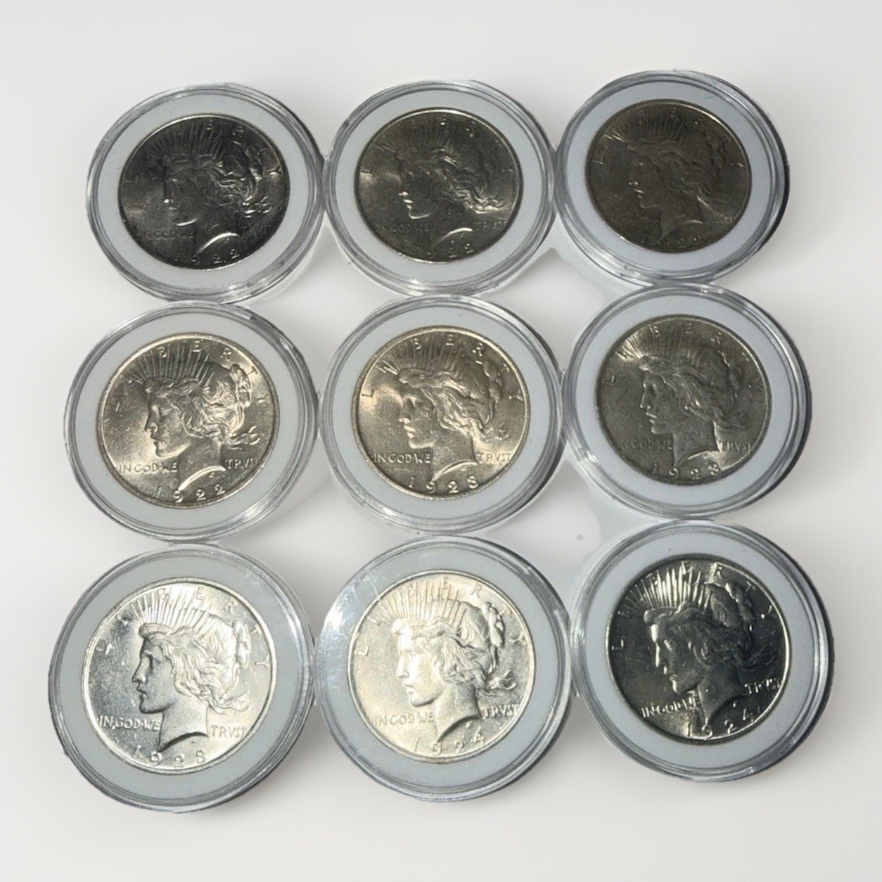 Set of NINE Peace Dollars BU, 1922 (3), 1923 (4), and 1924 (2) - In Capsules