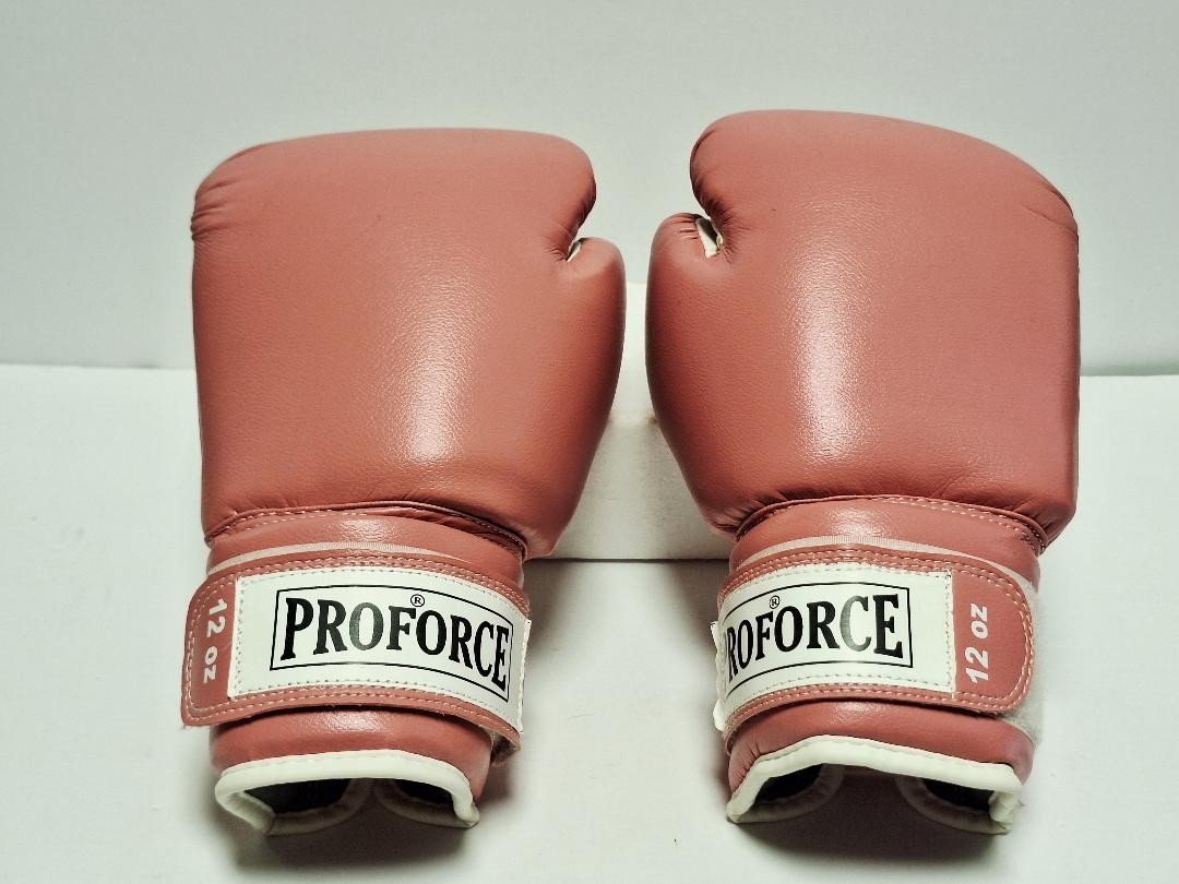 A pair of 12 oz ProForce Leatherette Boxing Gloves in pink