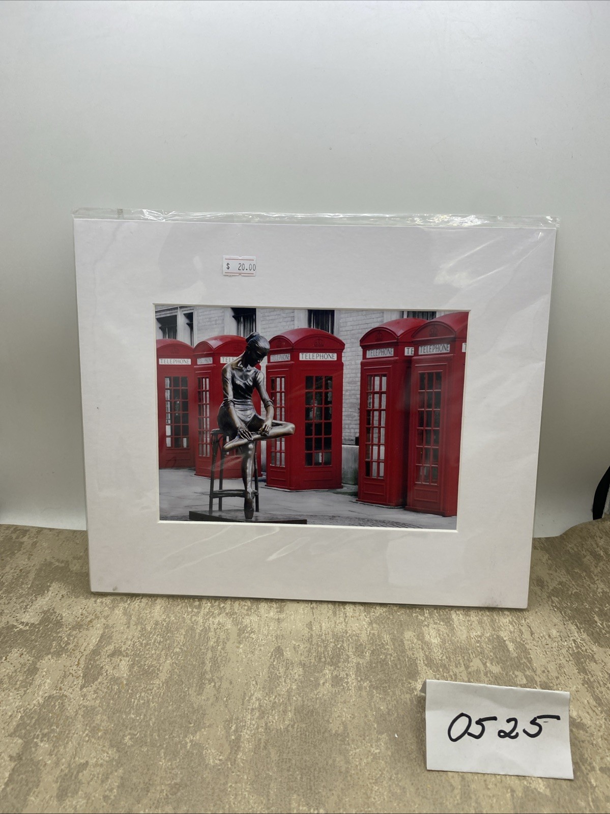 Photograph Of Young Ballet Dancer Sitting On Stool Beside Row Of Telephone Boxes