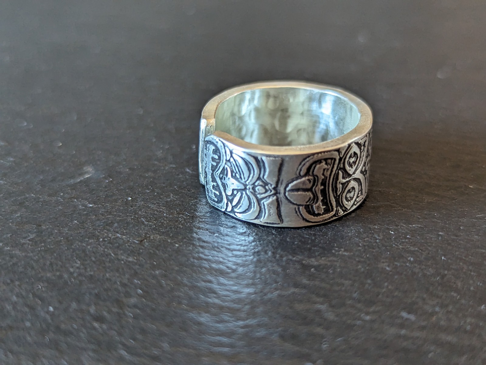 Thick sterling silver ring with tiki gods - handmade - open design