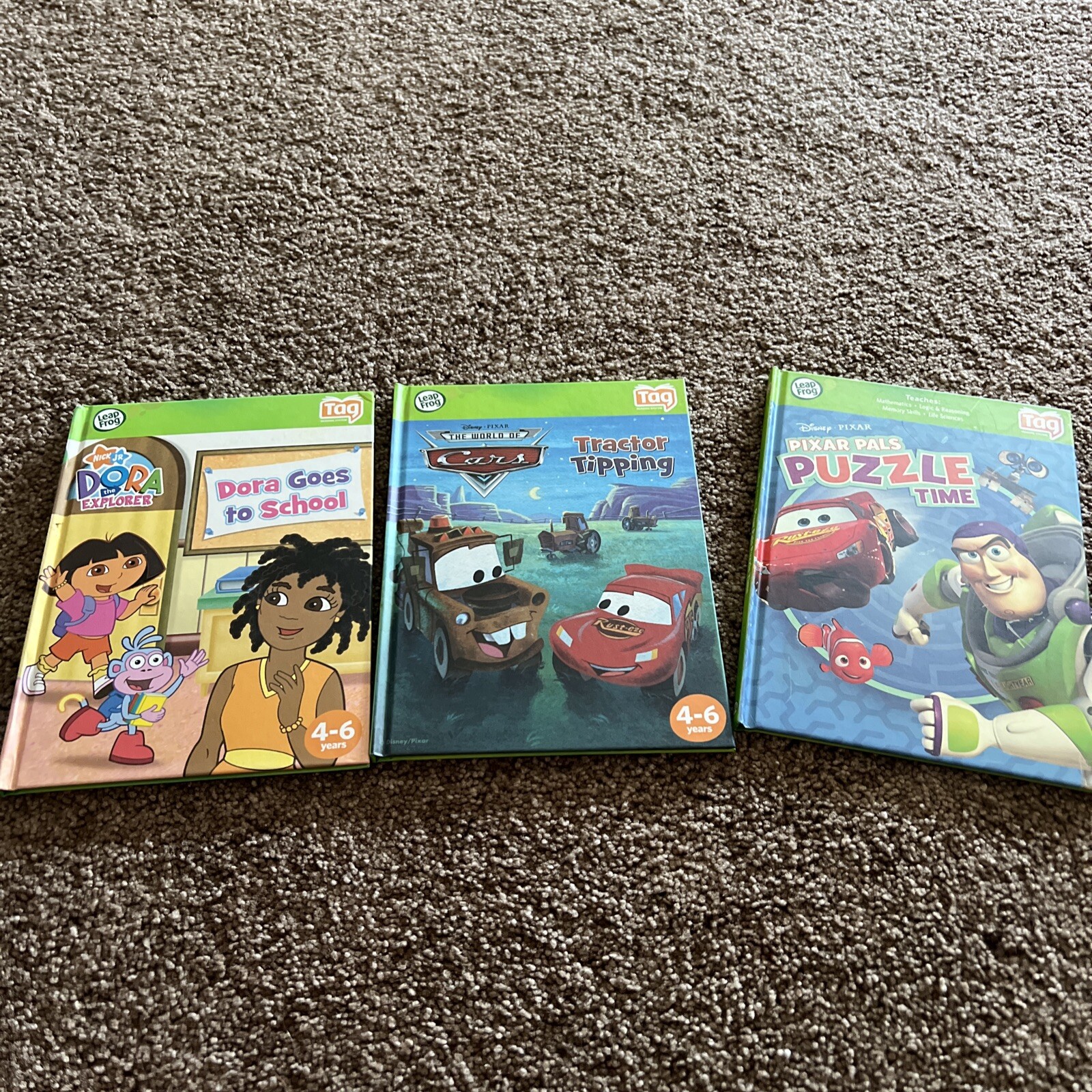 Leap Frog TAG Disney Pixar Cars The Movie Tractor Tipping book/Dora/Puzzle Time