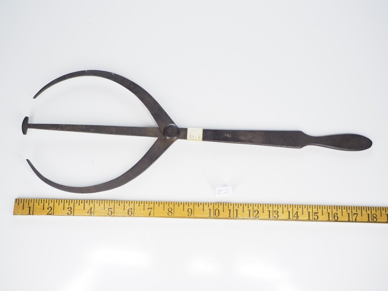 Antique double caliper, Black surface  minor pitting very little red rust.