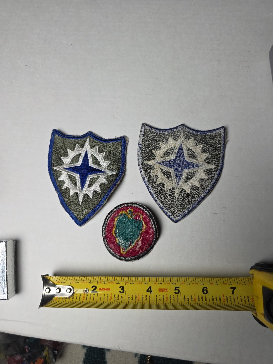 U.S. Army XVI Corps (16th Army Corps) patches, from the World War II era. 1945