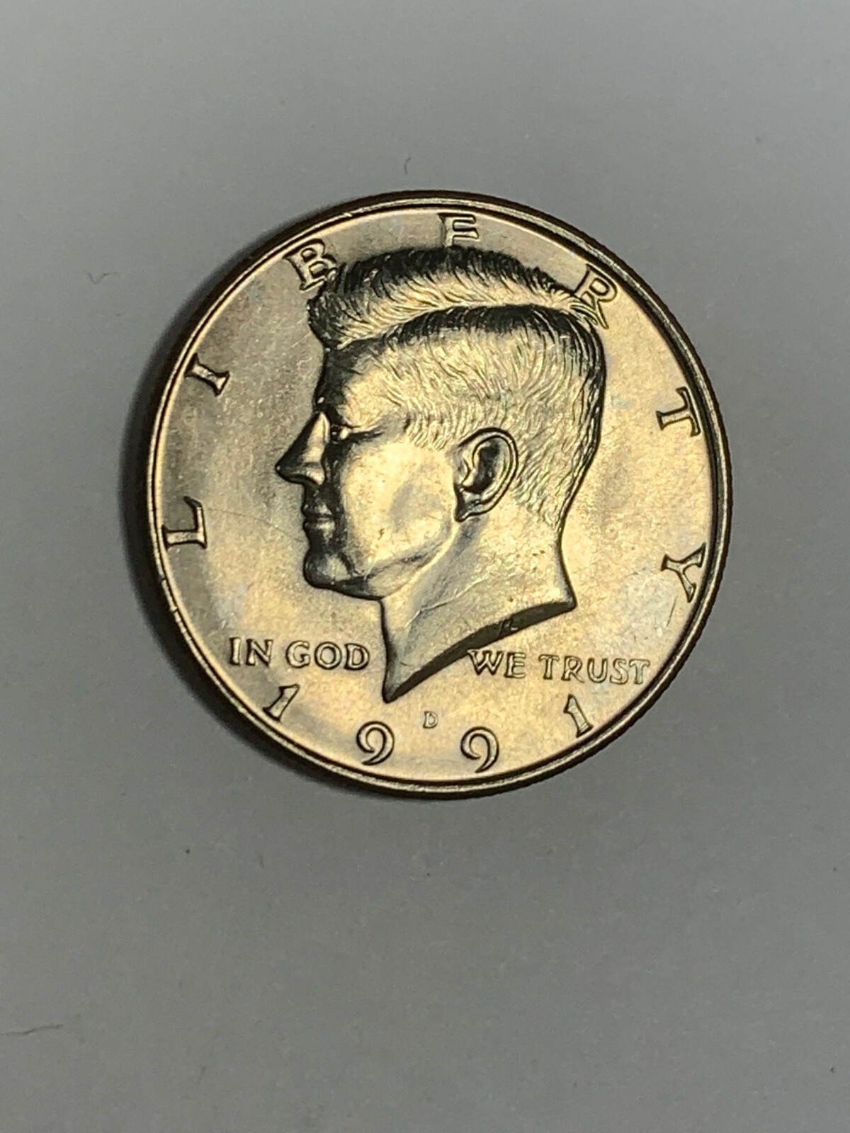 1991-D Clad Kennedy Almost Uncirculated to Uncirculated Half Dollar