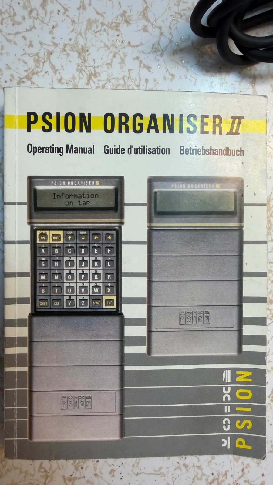 Psion Organiser II with powered comms link cable/charger 8K data pack