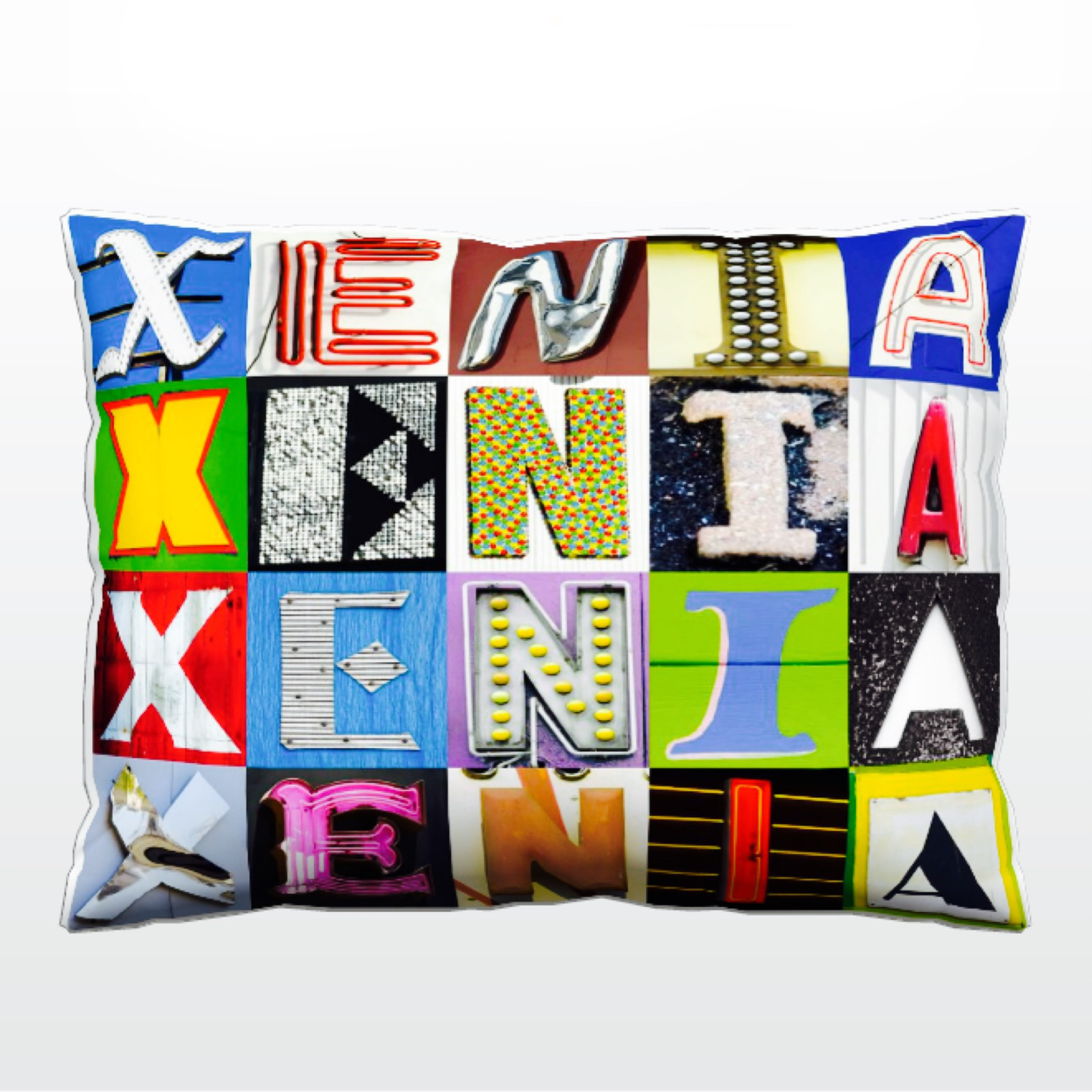 Personalized Pillow featuring the name XENIA in photos of actual sign letters