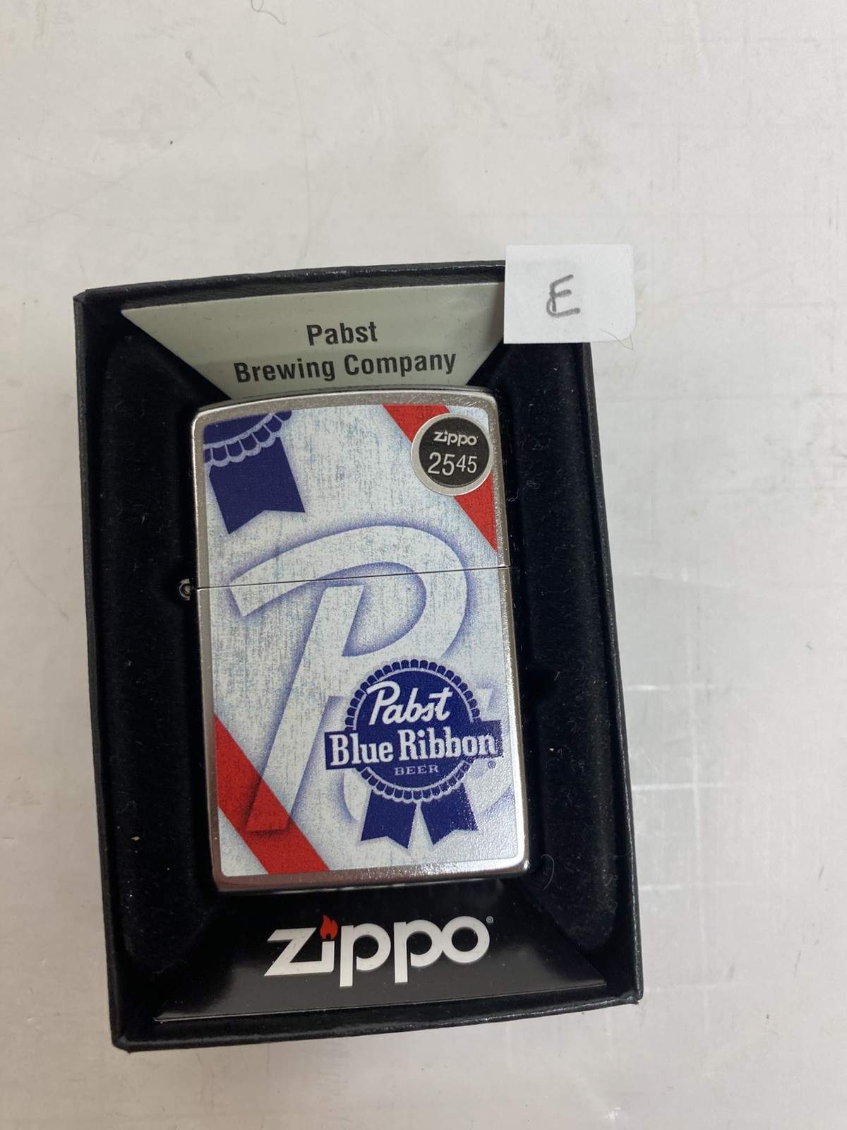 NEW IN BOX ZIPPO LIGHTER - PAPST BLUE RIBBON -STREET CHROME RIBBON LOGO - E
