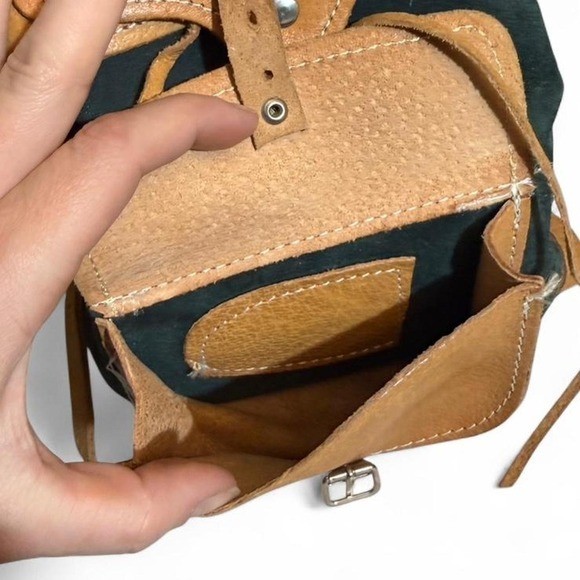 Forest Green Suede and Tan Leather backpack with adjustable straps.