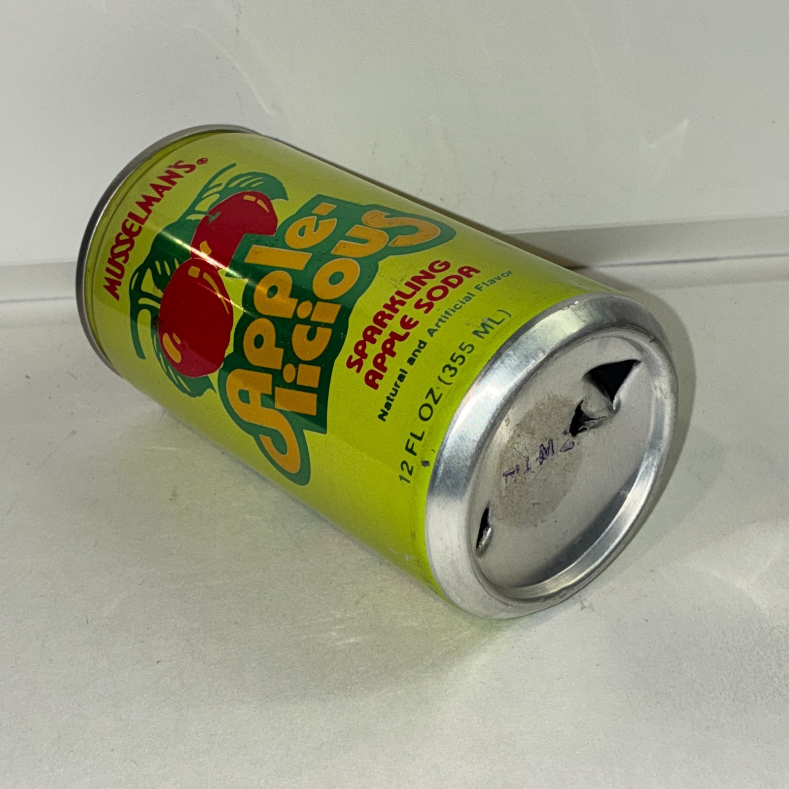 Musselman's Apple-licious Apple soda can, bottom opened
