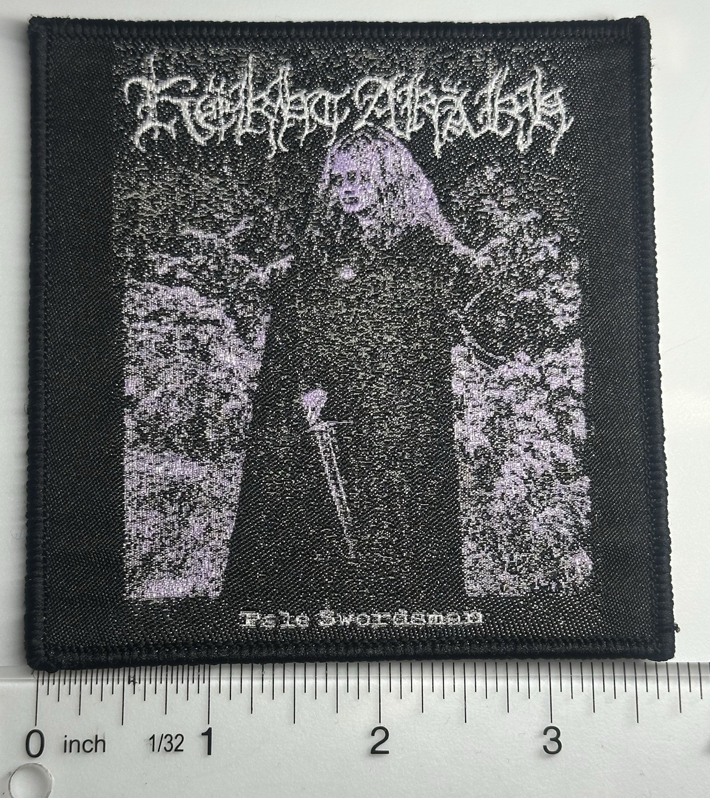Këkht Aräkh Pale Swordsman Black Border Woven Patch