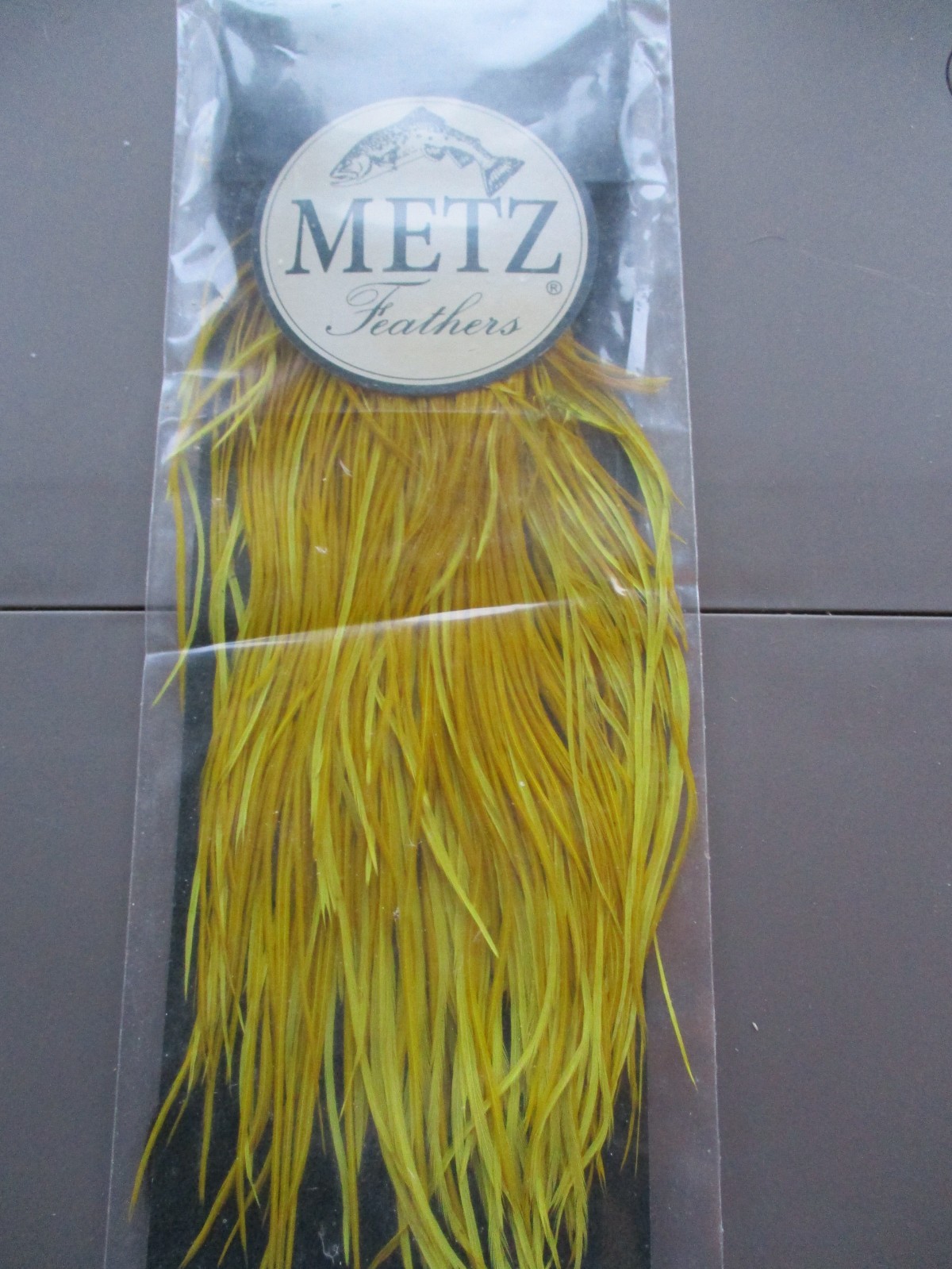 metz saddle grade 2 golden olive rooster hackle feather