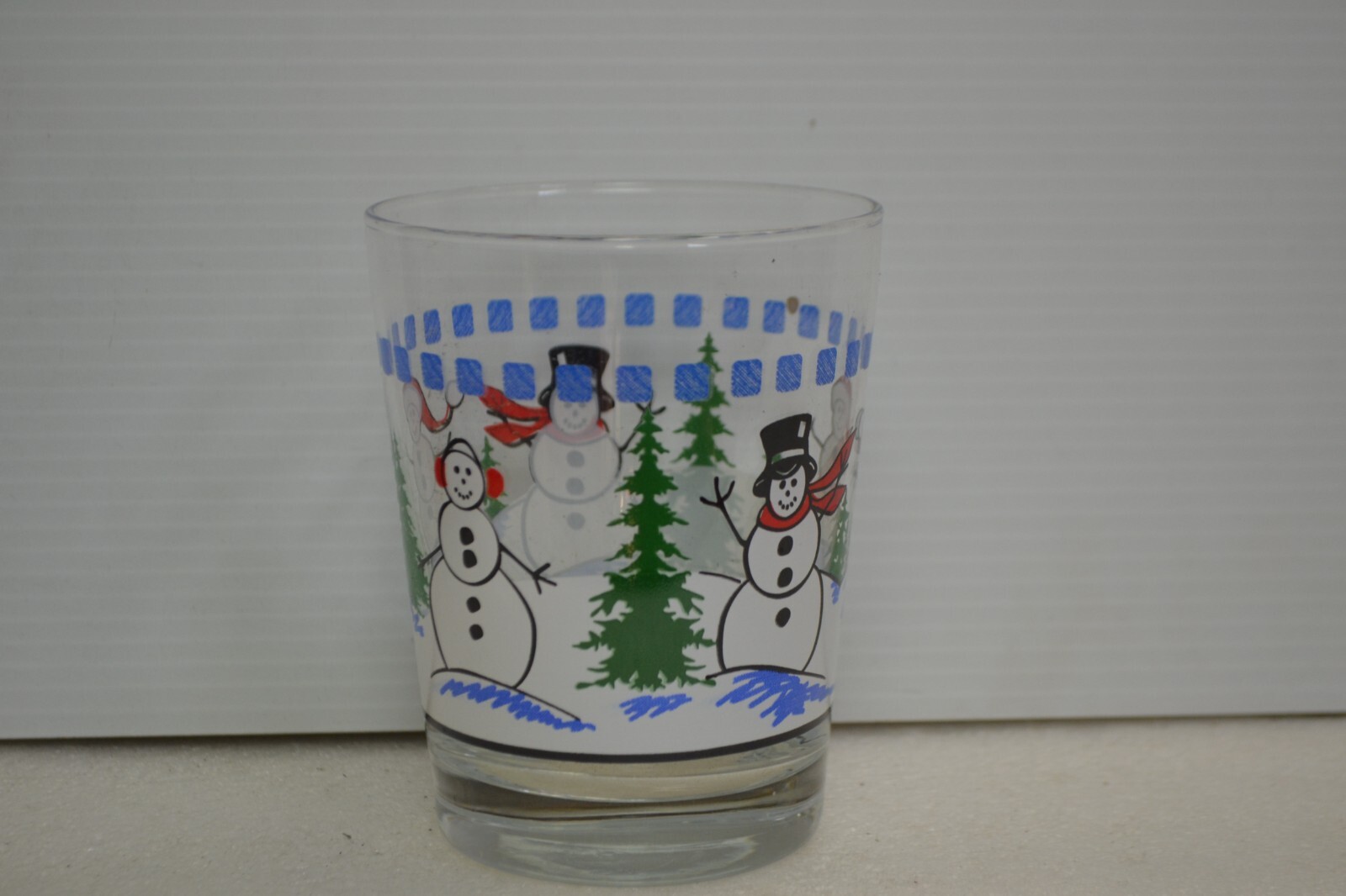 snow man drinking glass