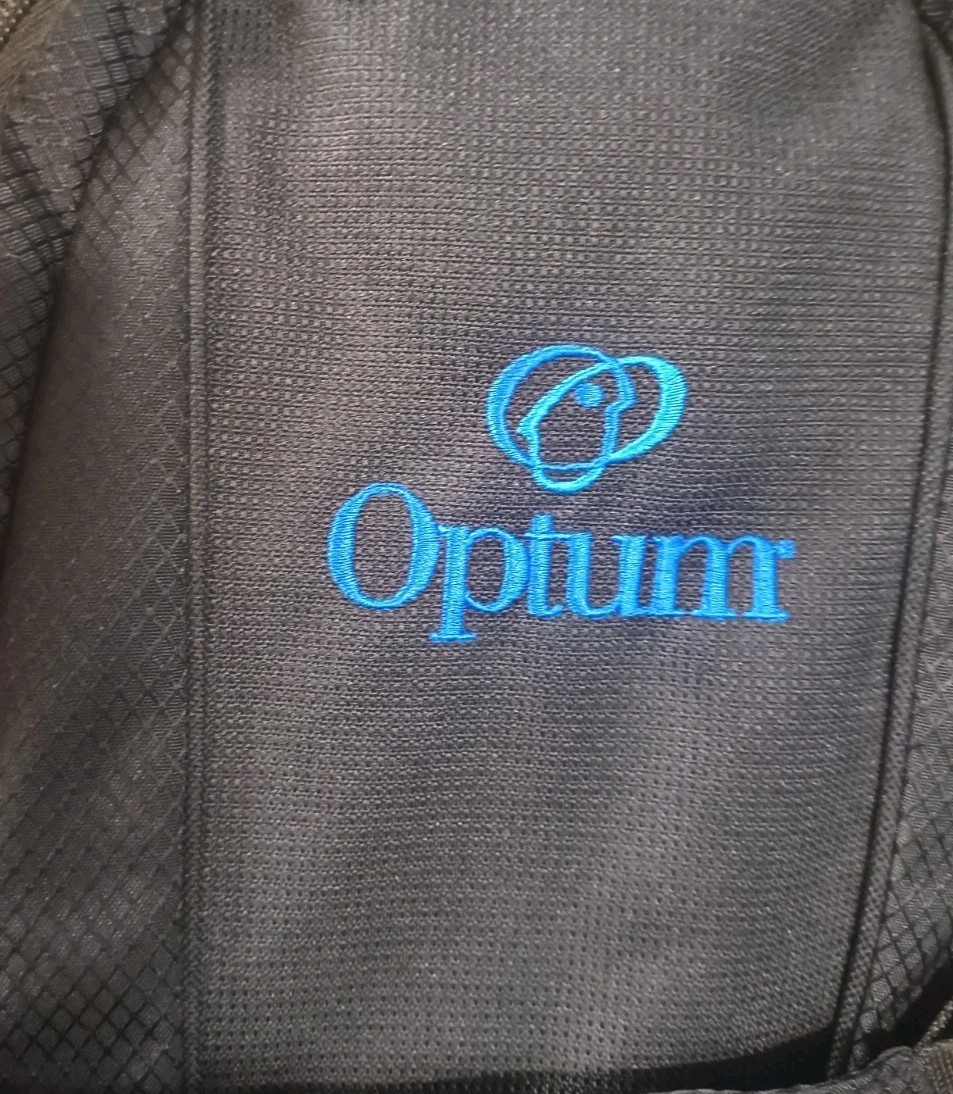 High Sierra lightweight hiking hydration pack customized with a blue Optum Logo