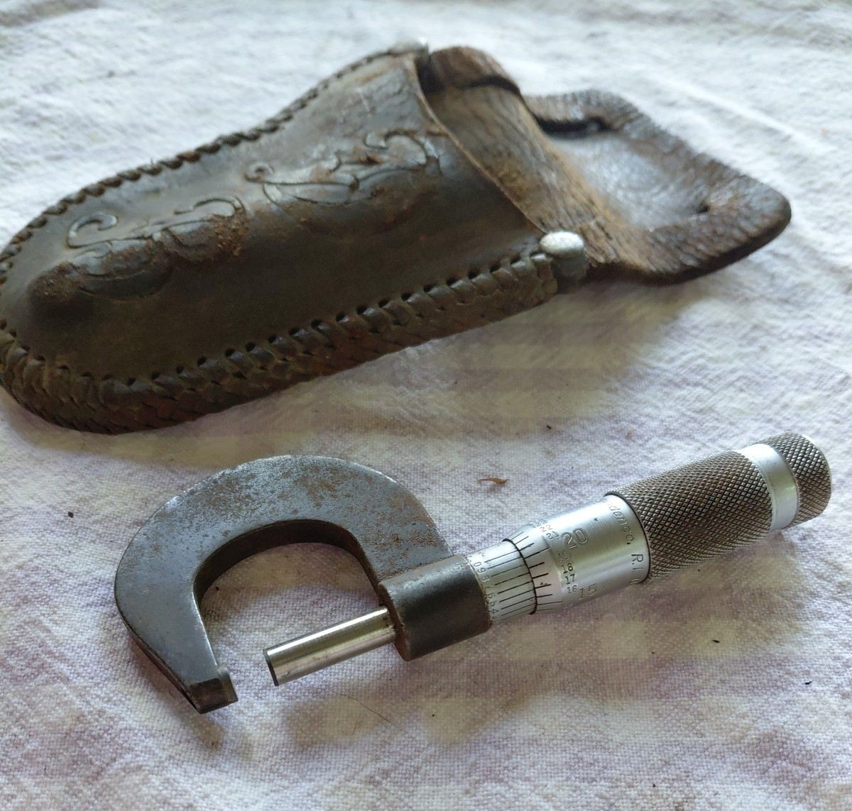 brown sharp micrometer and leather pouch