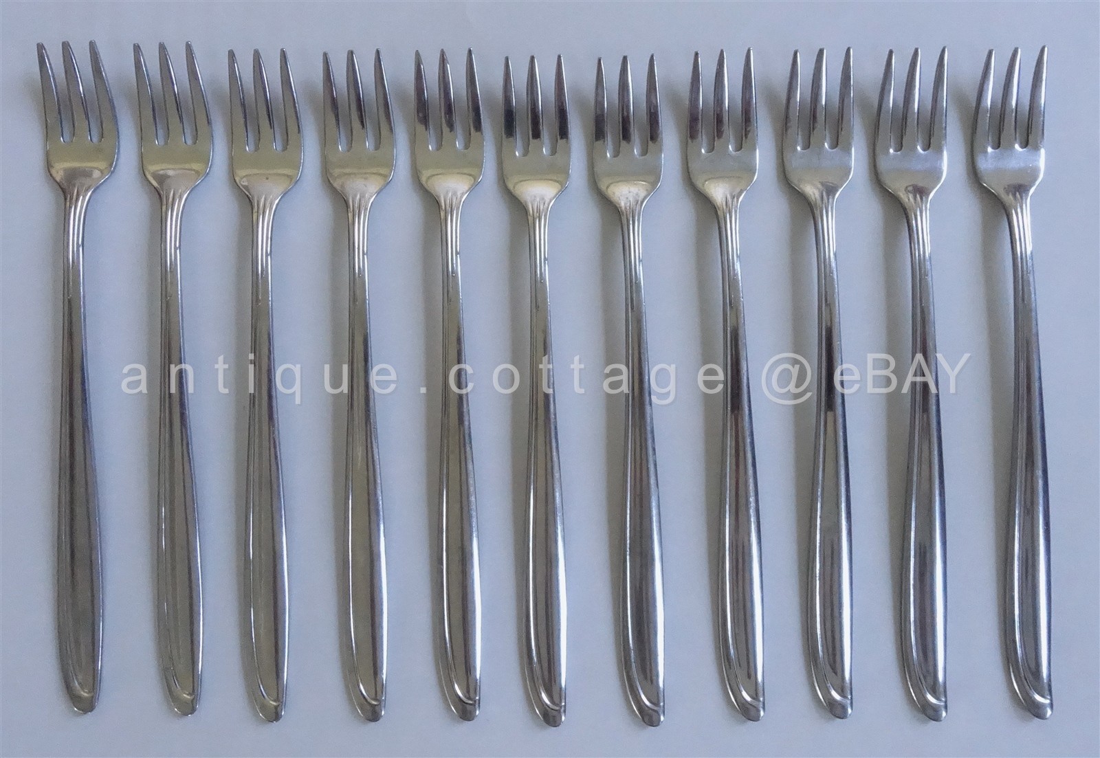 vintage ONEIDA STAINLESS FLATWARE retro unknown pattern 11 COCKTAIL FORKS