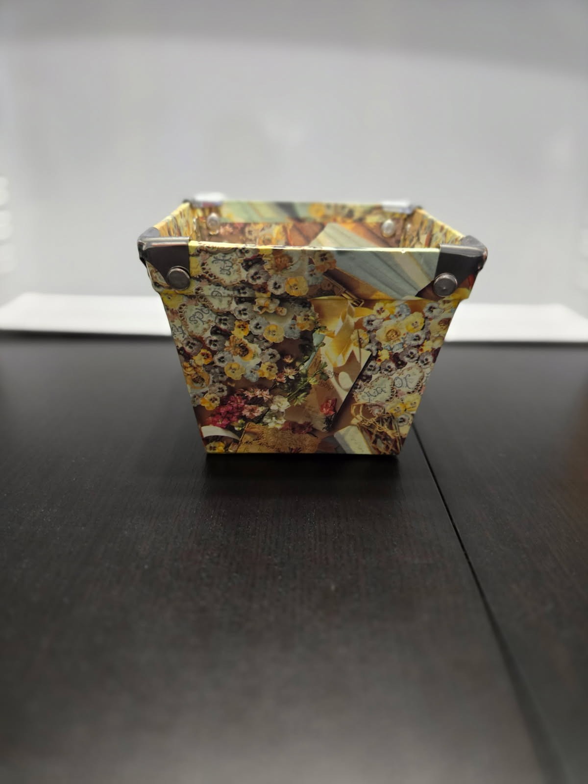 Decorative paper basket with a floral pattern