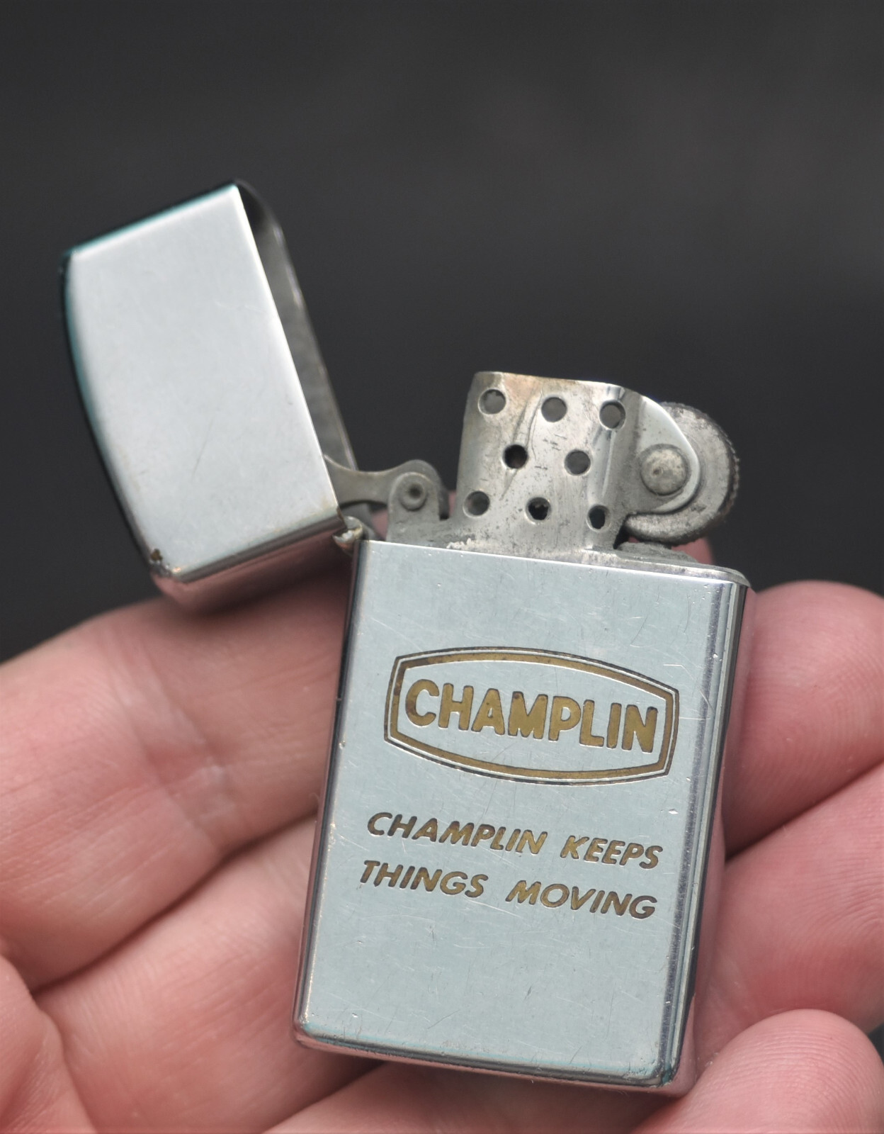 VINTAGE CHAMPLIN KEEPS THINGS MOVING ZIPPO SLIM FLAT BOTTOM IIII IIII
