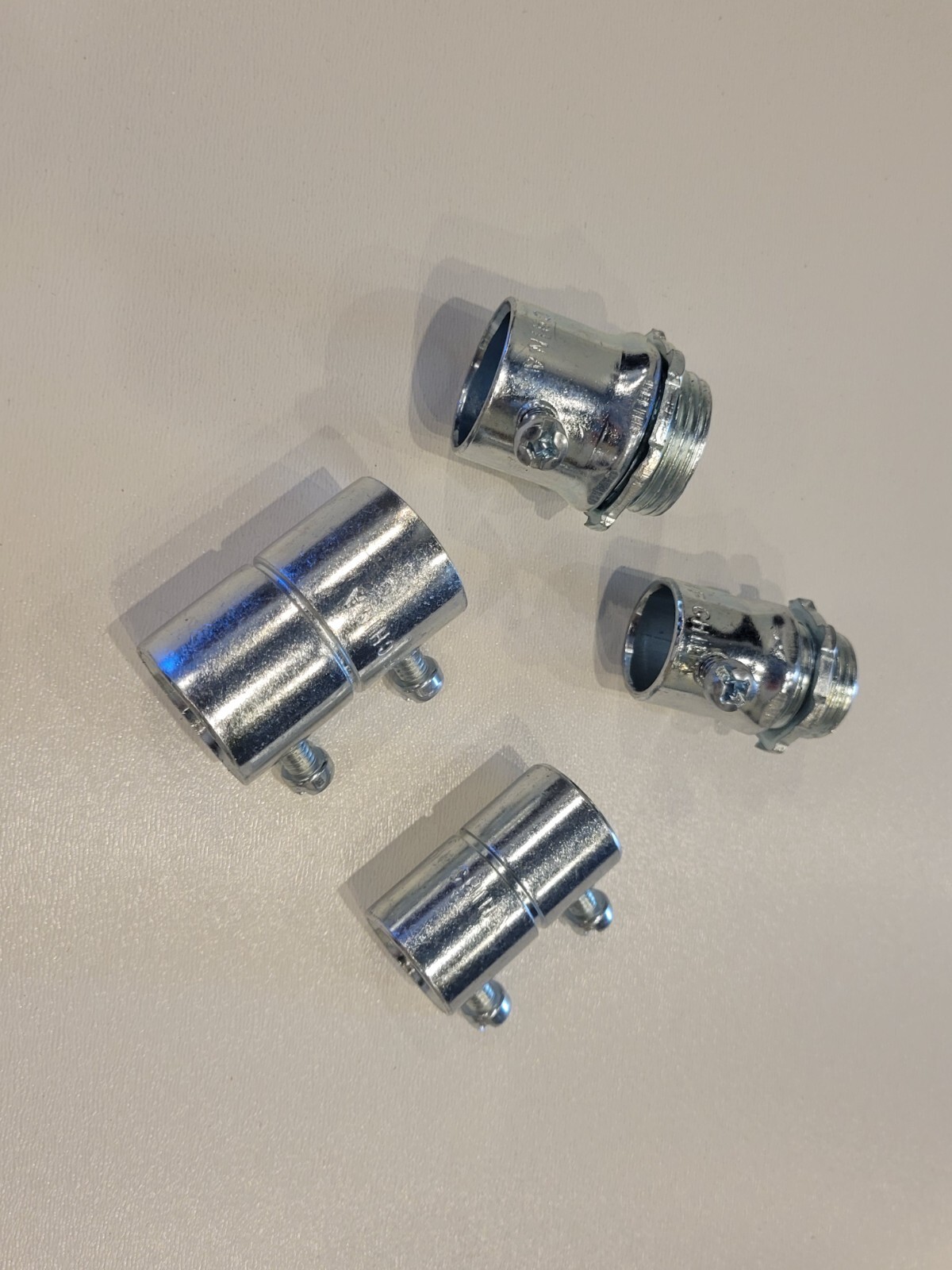 New box of 50 1/2" Steel EMT set screw couplings, UL listed