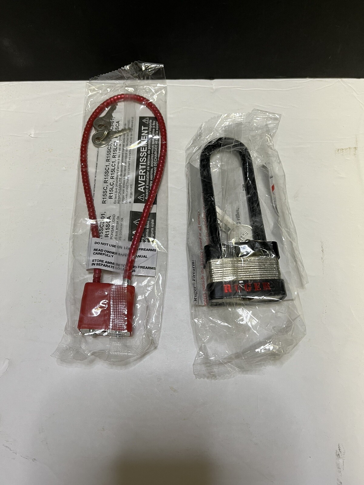 Lot Of 2 Ruger Gun Locks 1 Cable Style And One Padlock Style Both Brand New
