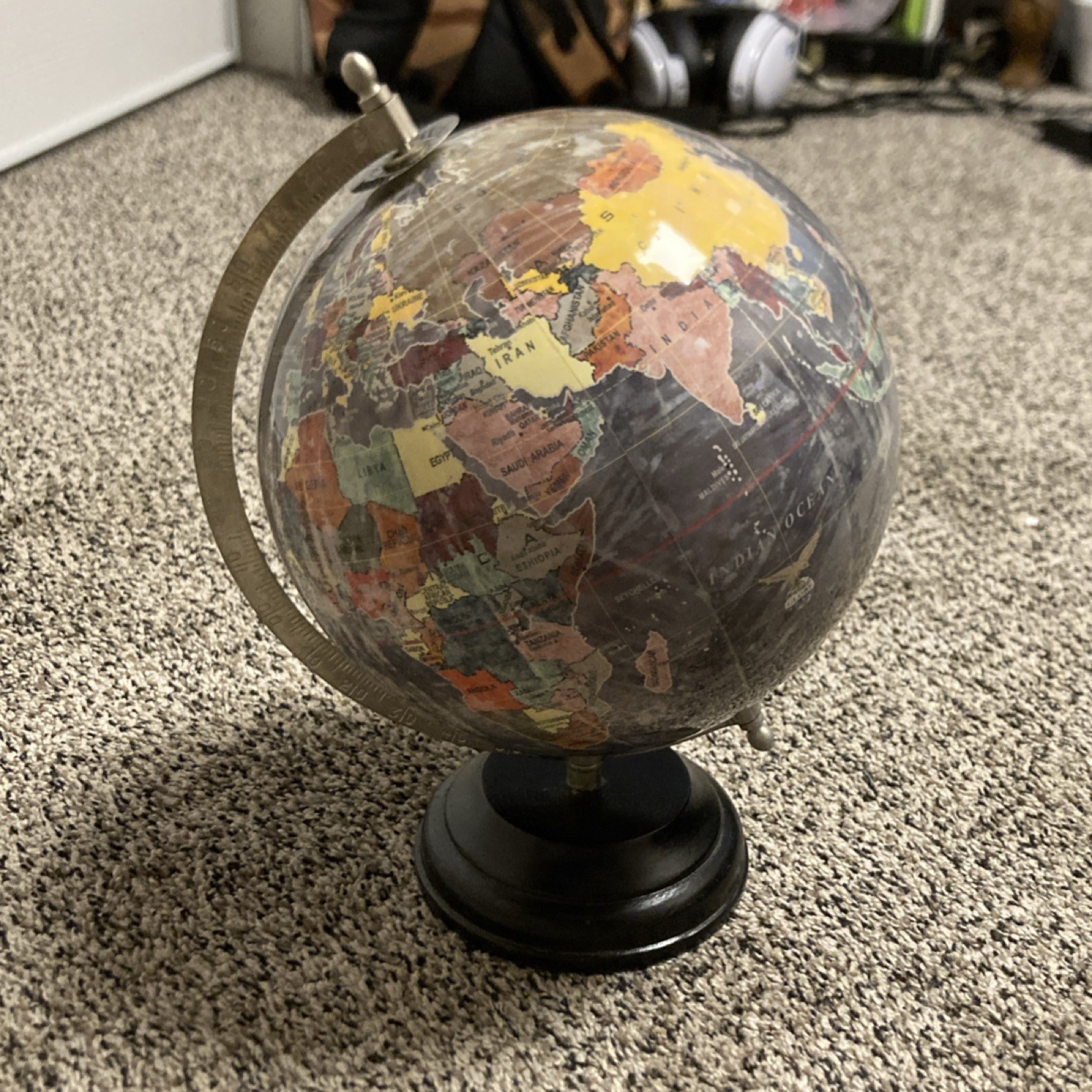 Decorative Multicolor Tabletop Globe, Metal Arm, Black Base, Spinning Feature