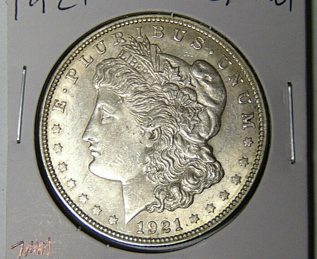 Choice AU 1921-P Morgan Dollar Attached 7MM Lamination Eagles Breast 102621