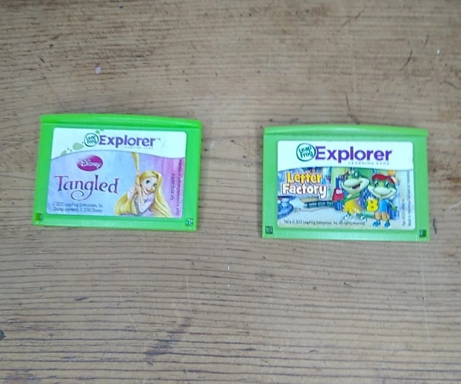 Leap Frog LeapFrog Explorer Lot of 2 Games Disney Tangled and Letter Factory