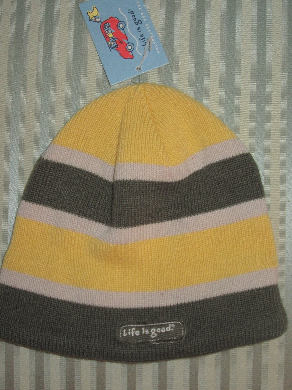 NWT. LIFE IS GOOD ADULT STRIPED FLEECE LINED BAND KNIT BEANIE W/JAKE LOGO(OS)