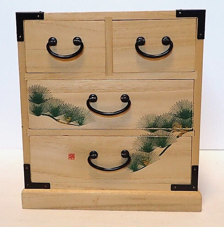 tansu or mini chest of drawer, wooden craftwork of japan with tree illustrated