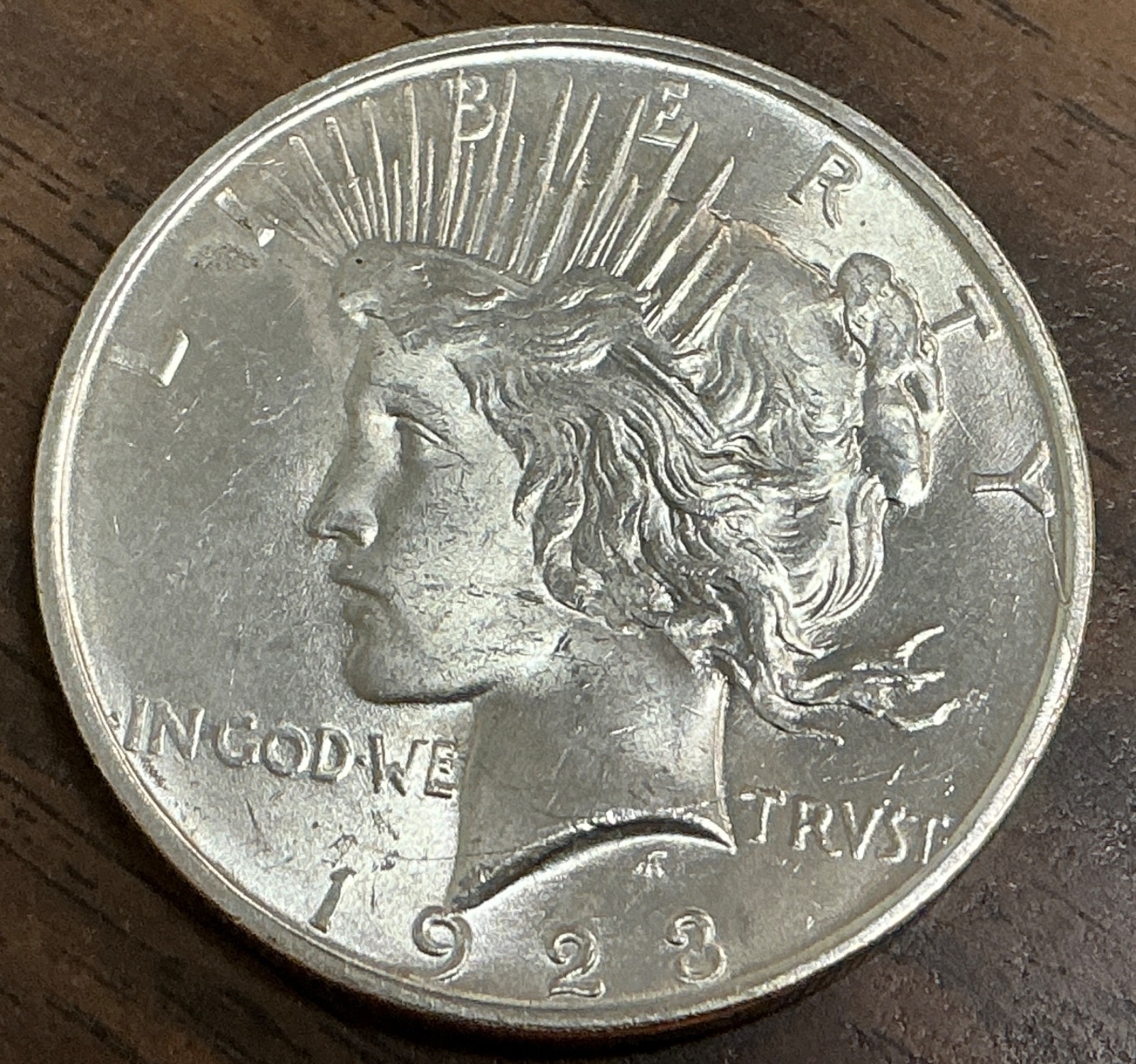 1923-D - $1 Peace Silver Dollar - BU - Die Breaks