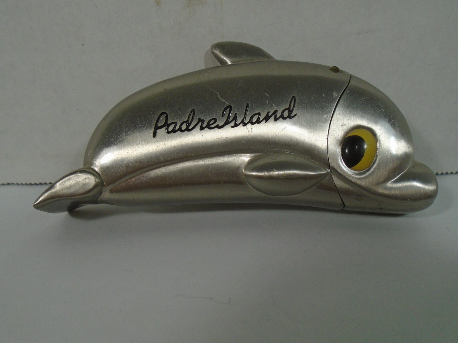 PADRE ISLAND , TEXAS--METAL DOLPHIN LIGHTER (LOOK)