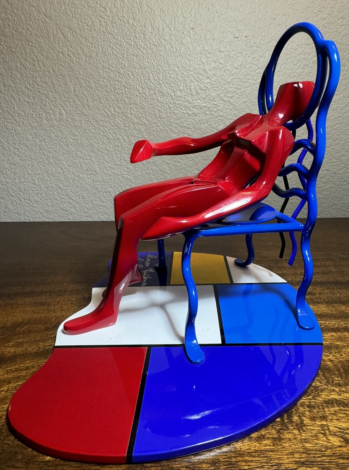 Sitting on Chair Bronze Sculpture By Amor Geifman