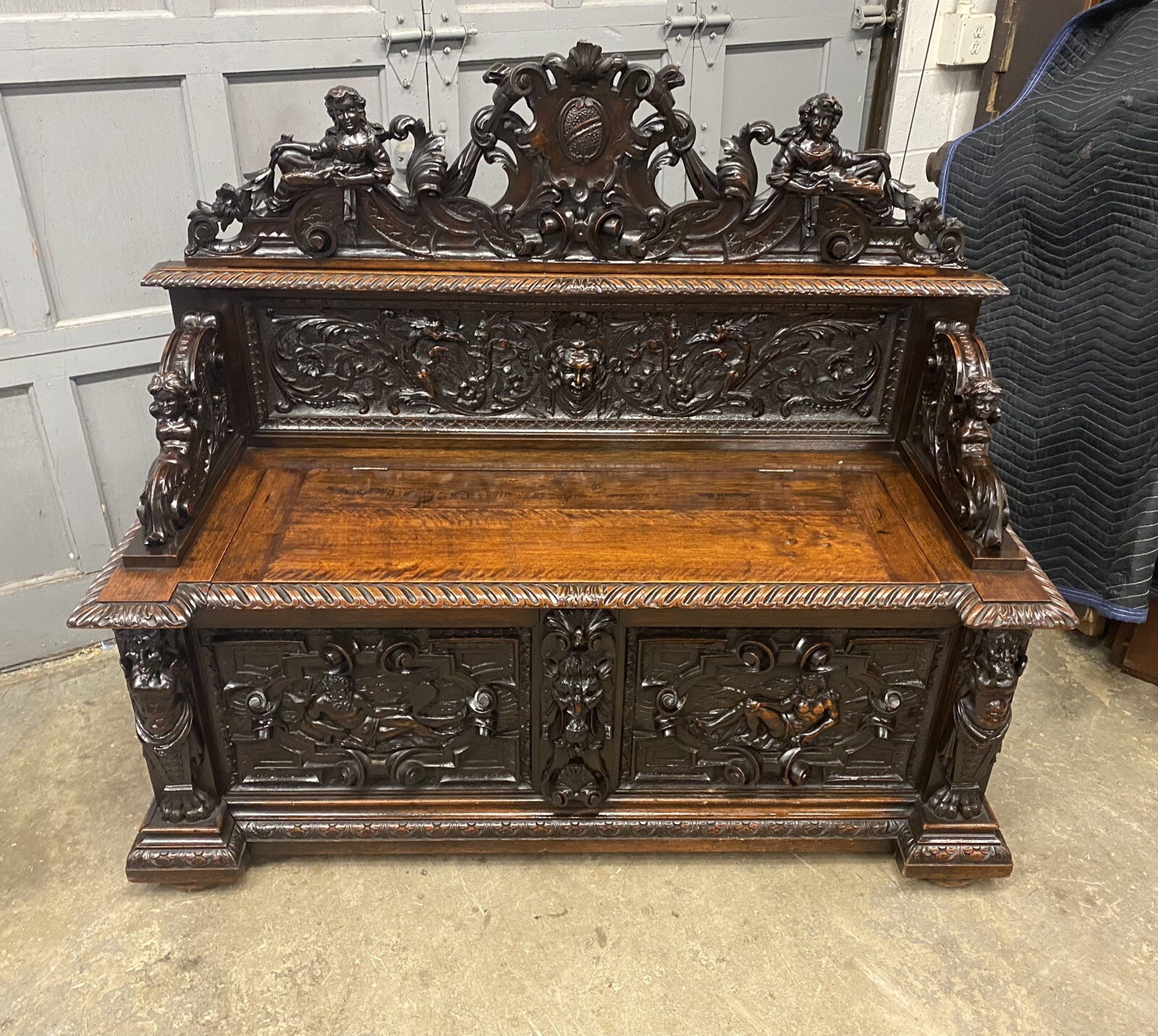 CARVED FIGURAL WALNUT BENCH