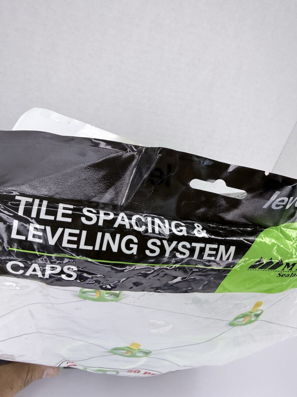 Levolution Tile spacing and Leveling System Caps Part B 50 Pc Bag + Tool