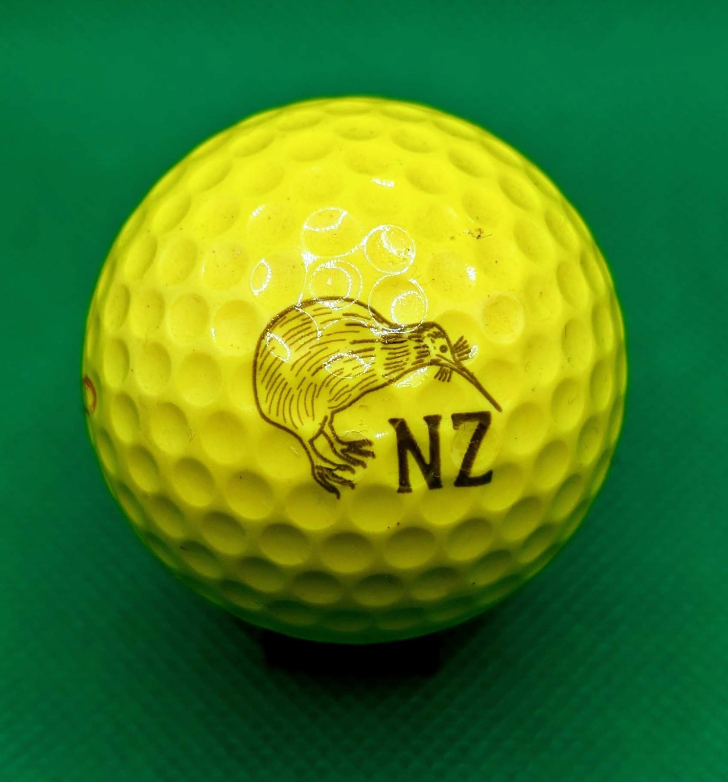 Vintage Yellow New Zealand Kiwi logo golf ball