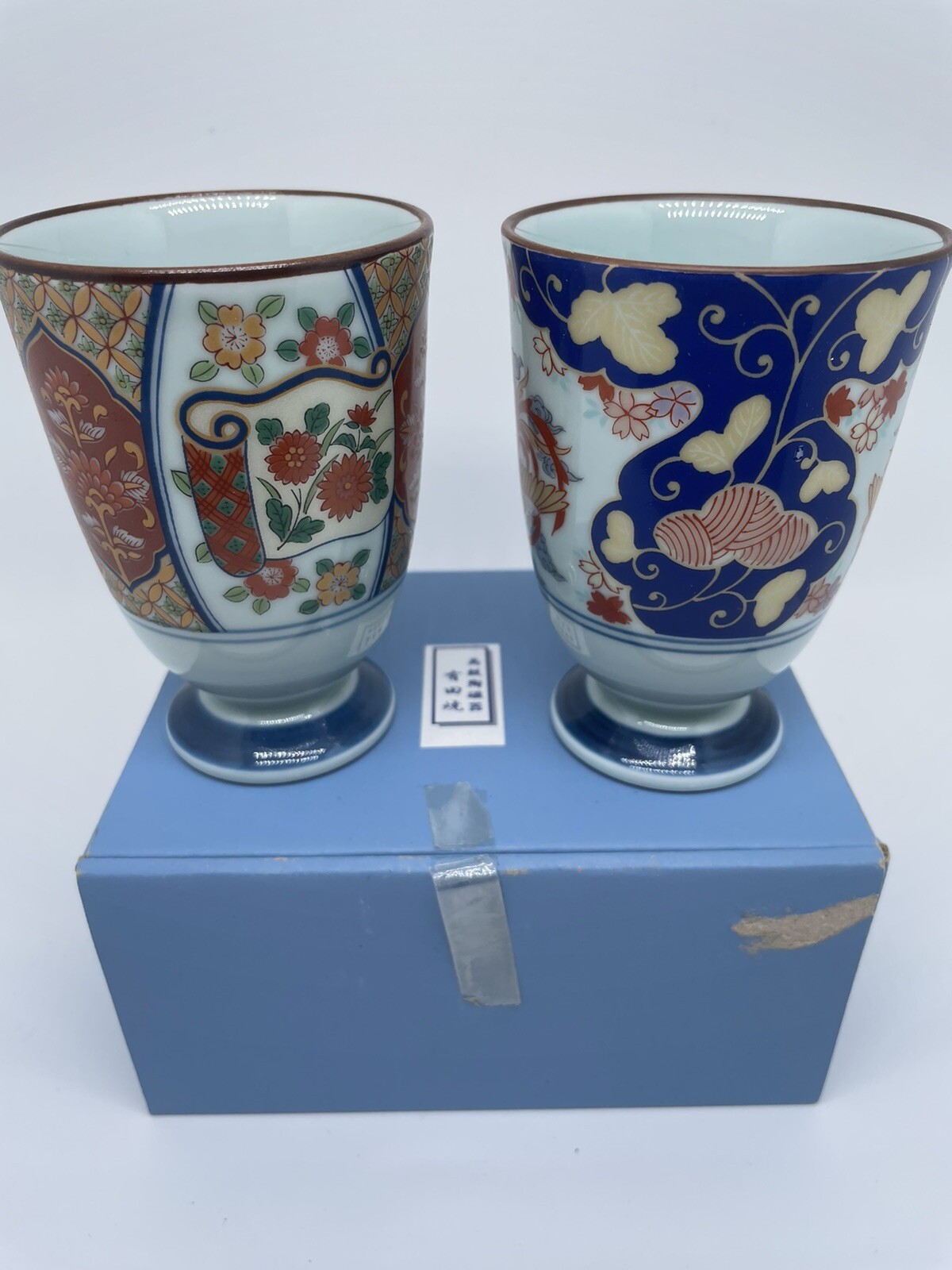 2 Asian cups in box