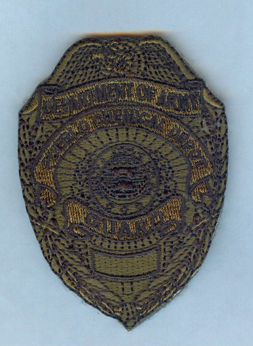 U.S. ARMY PUEBLO CHEMICAL DEPOT GUARD BADGE (WOODLAND SUBDUED) .... MINT .... X