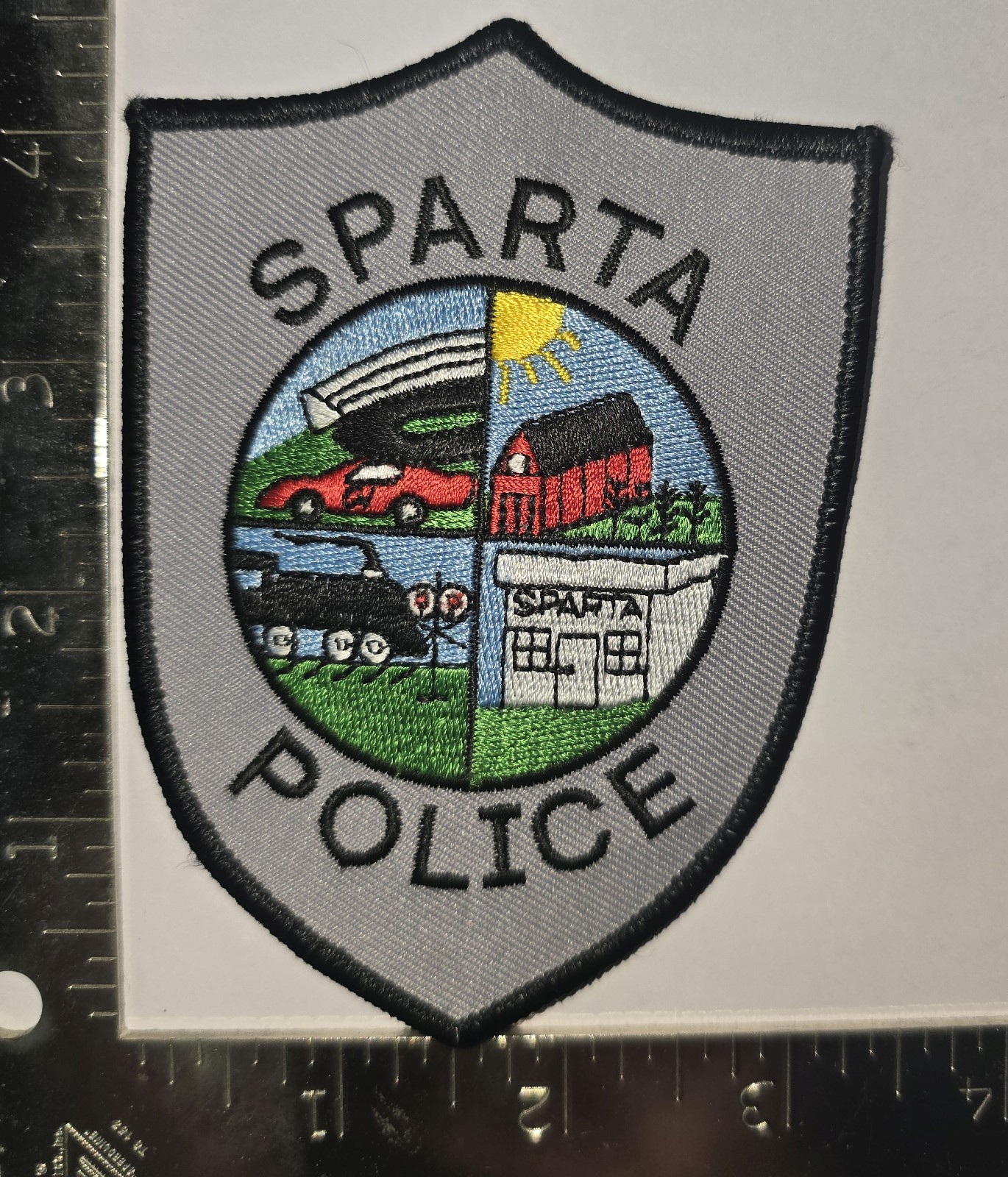Sparta Police Patch – Four‑Panel Town Scene
