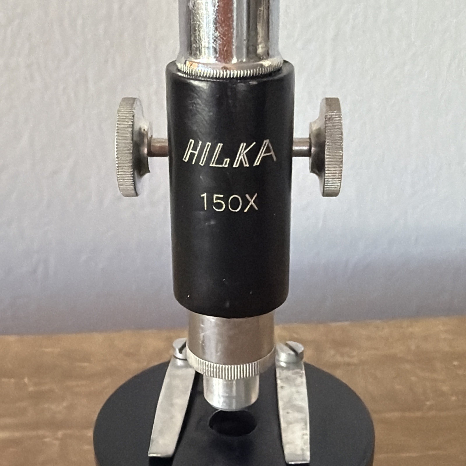 Vintage HIKA 150x Microscope 5in. Includes 3 slides and original box.