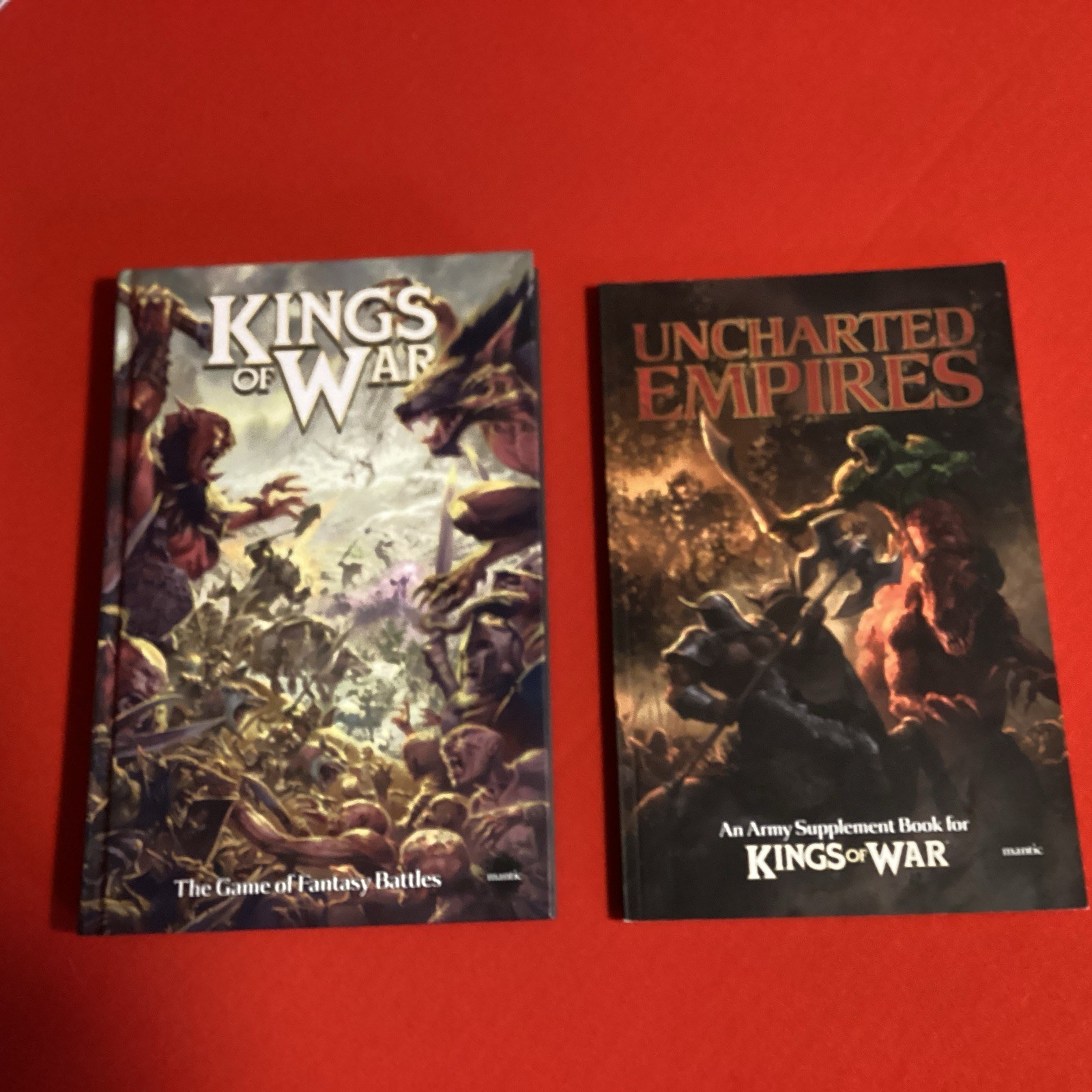 Kings of War - Mantic Rulebook Hardback with uncharted empires supplement book