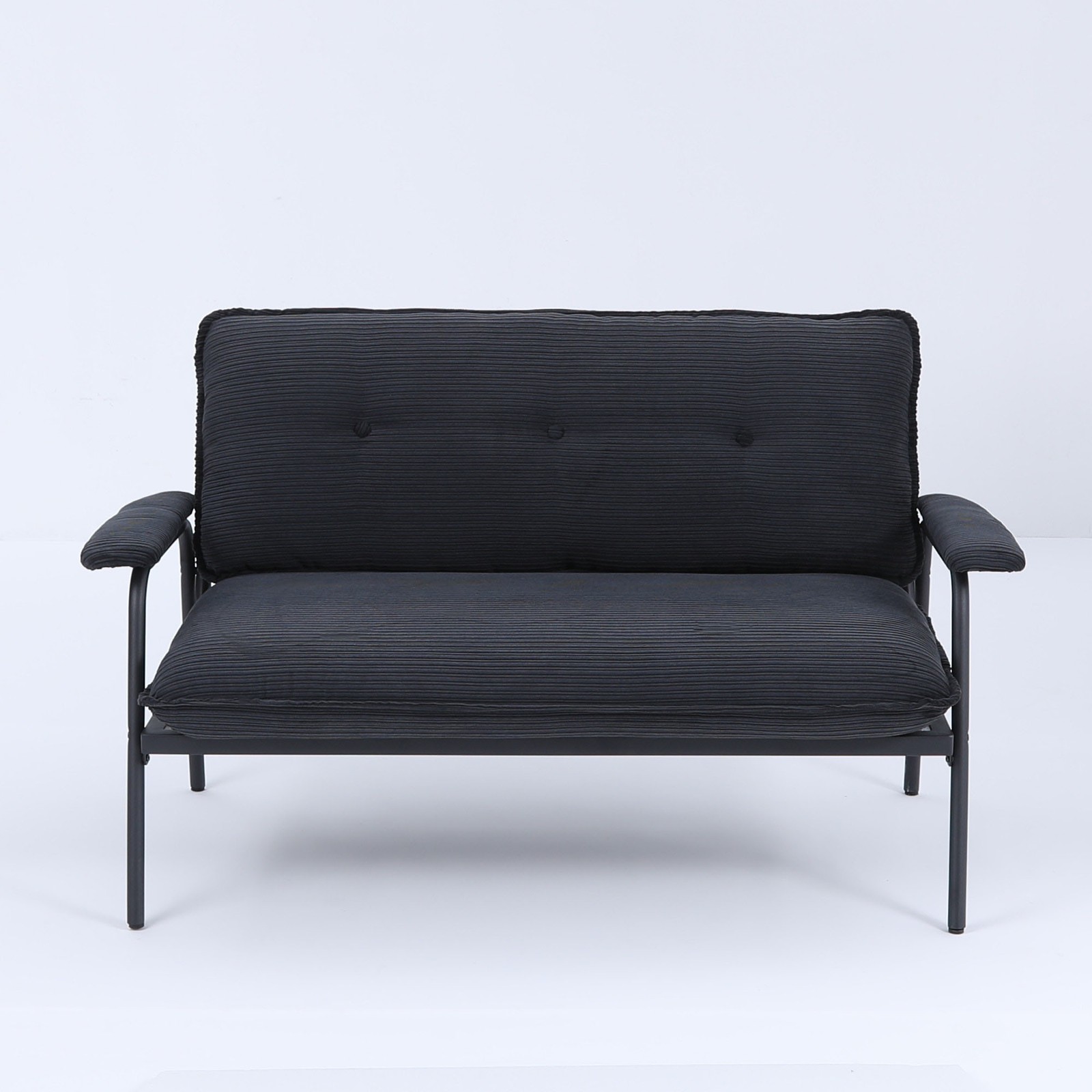 The 53-inch black sofa offers a spacious layout in the small apartment, easily