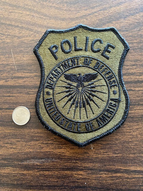 DEPT OF DEFENSE SHOULDER PATCH - FOR CIVILIAN POLICE (WOODLAND SUBDUED) ..... X