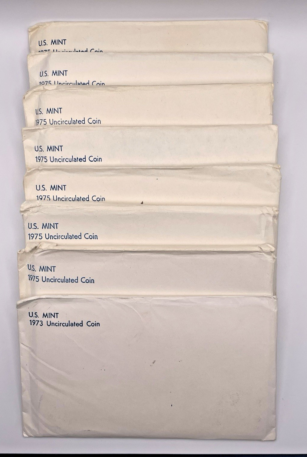 Lot of Eight (8) U.S. Mint Uncirculated Coin Sets OGP ~ (1) 1973 & (7) 1975